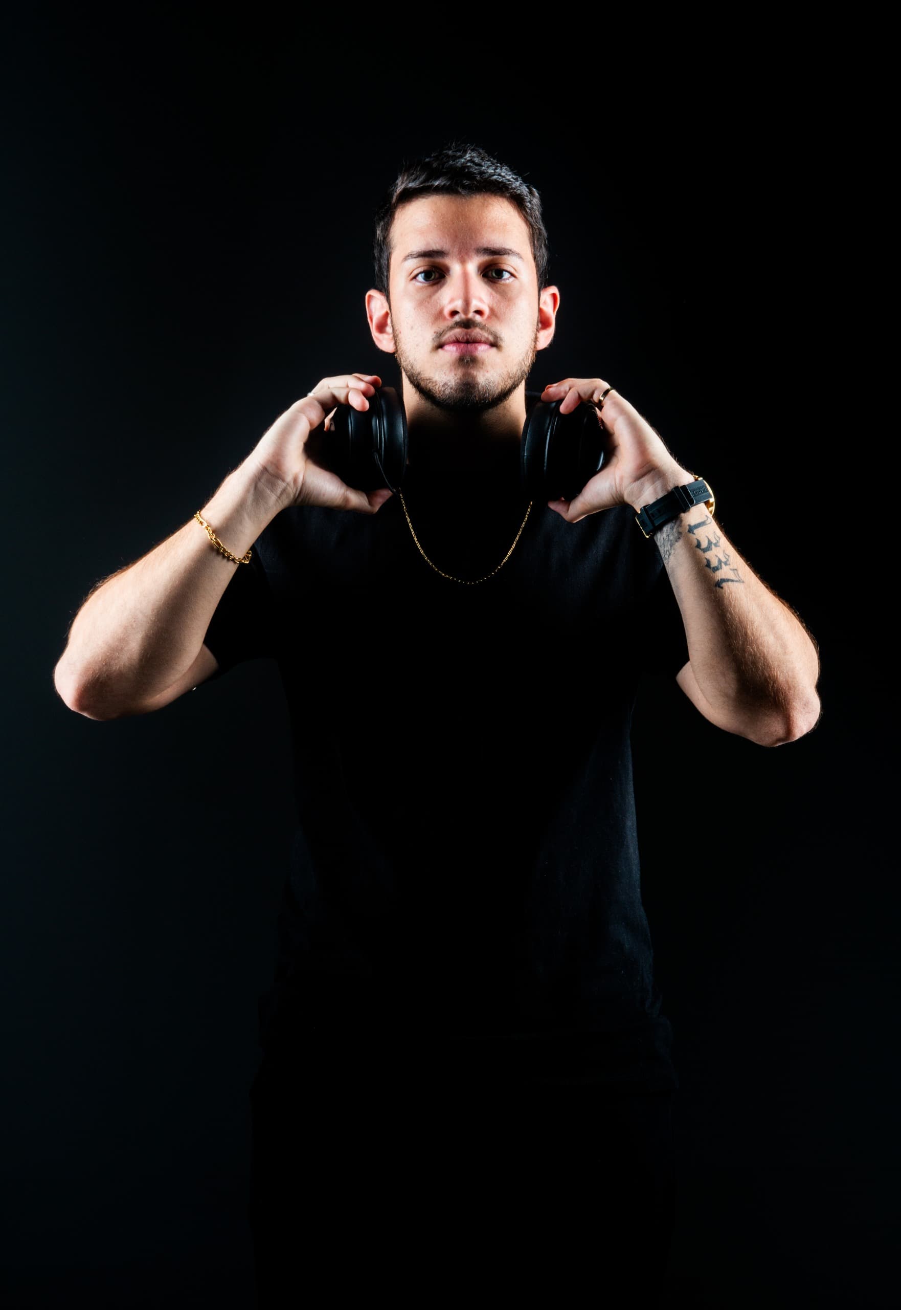 Professional esports player portrait, young male gamer with headset, confident pose, gaming setup background, neon lighting